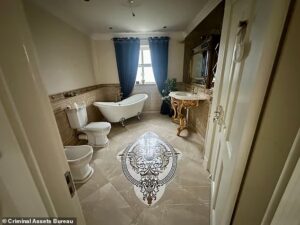Inside the luxury homes of Ireland’s gangland kingpins: Lavish lives of Irish mob clans including Kinahans are revealed as cops seize gold watches, designer bags and sports cars