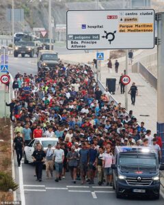‘People are dying here’: Migrants who broke into Europe tell other Moroccans to stay at home as Spain erects massive inflatable barriers in bid to stop 60,000-strong ‘invasion’