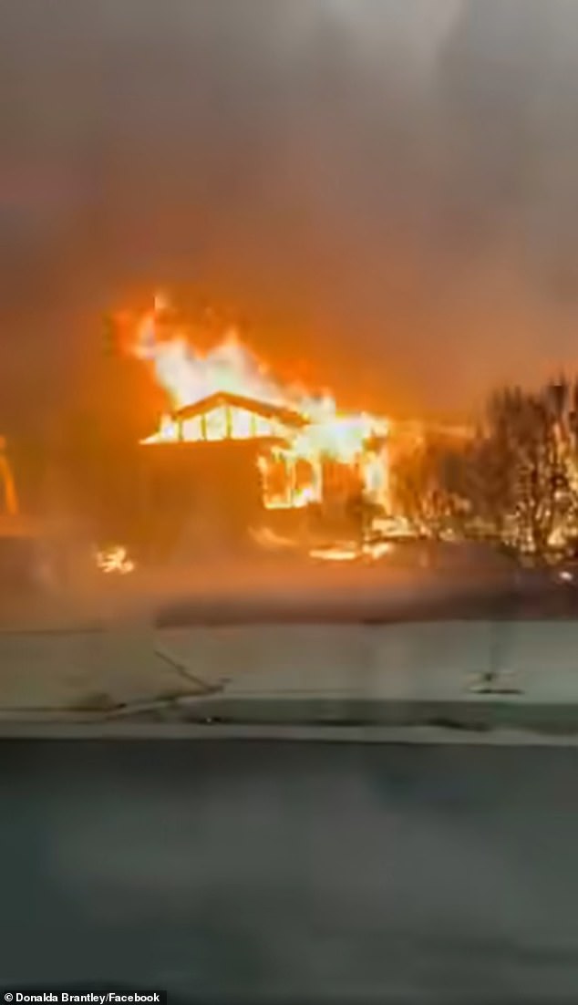 Catastrophic fast-moving fire tears through Spokane as thousands flee their homes and 4,000 buildings to be razed to the ground