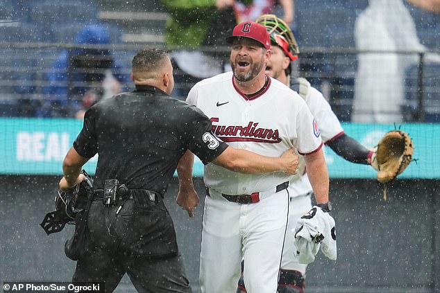 MLB benches clear in rainy Cleveland as grounds crew rushes to unfurl tarp amid chaos: ‘It’s a first for me’