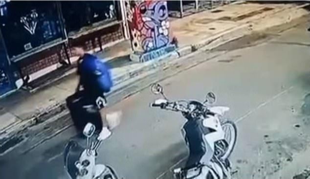 Moment ‘Afghan small-boat migrant drags suitcase with British woman’s body inside down Athens street’