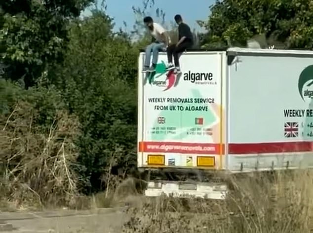 Moment illegal migrants climb out of lorry from Spain in Essex after ‘slicing their way through roof to sneak through security at Calais’