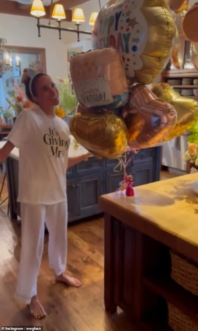 Meghan Markle posts clip of her dancing to a happy birthday song wearing a tiara-like headband as Harry laughs and says ‘oh dear’ – as Duchess celebrates turning 45